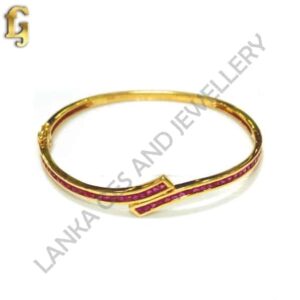 Bangle with Pink Sapphires set in 18k Yellow Gold